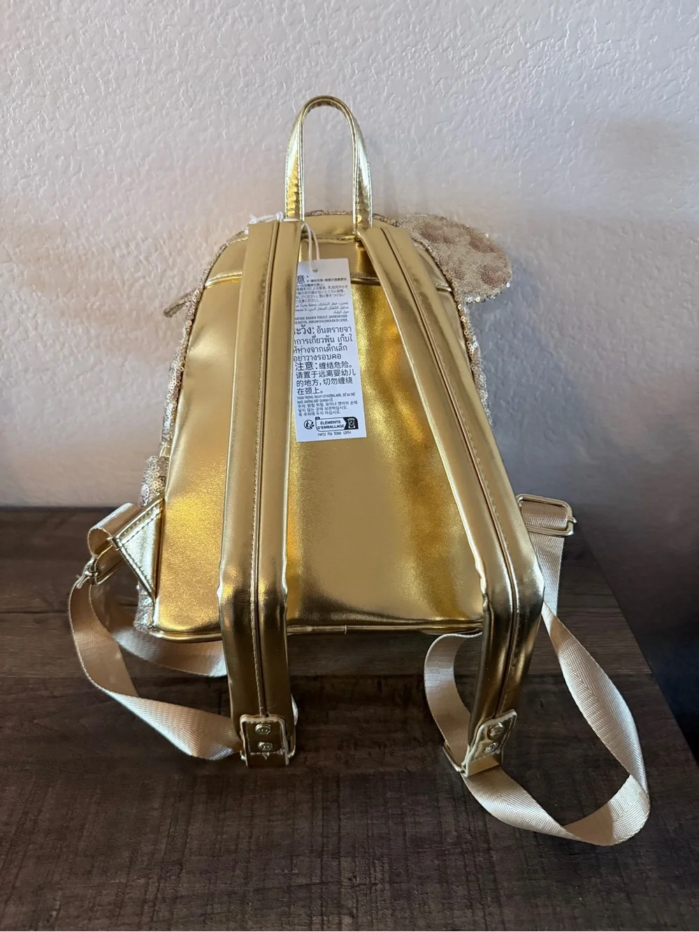 Loungefly Disney gold sequin backpack with hidden mickeys